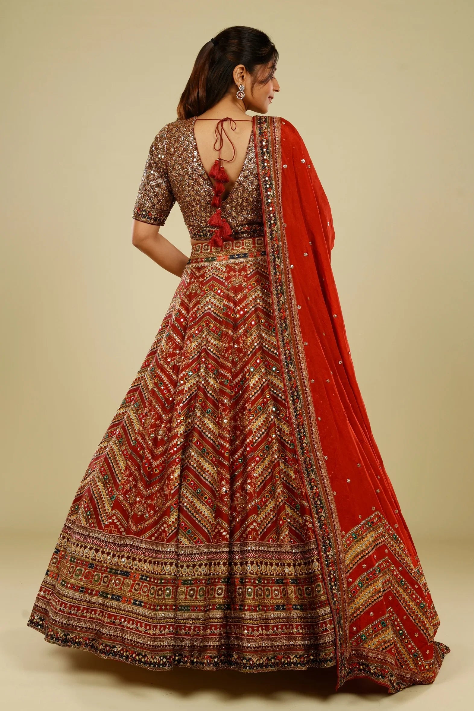 Rust Printed Silk Lehenga Set with Sequin & Kutdana Embroidery - Mokshaa