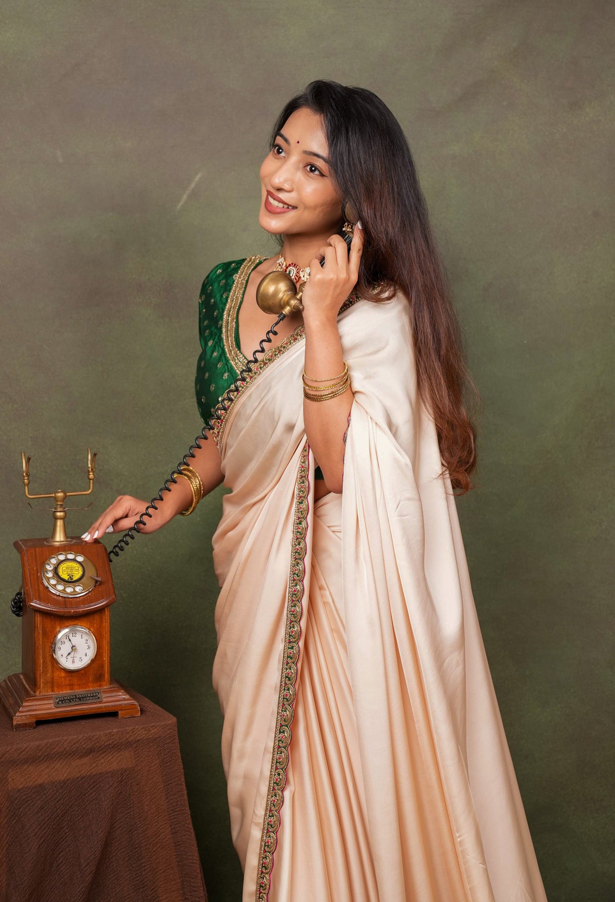 Peach Satin Saree with Green Embroidered Border