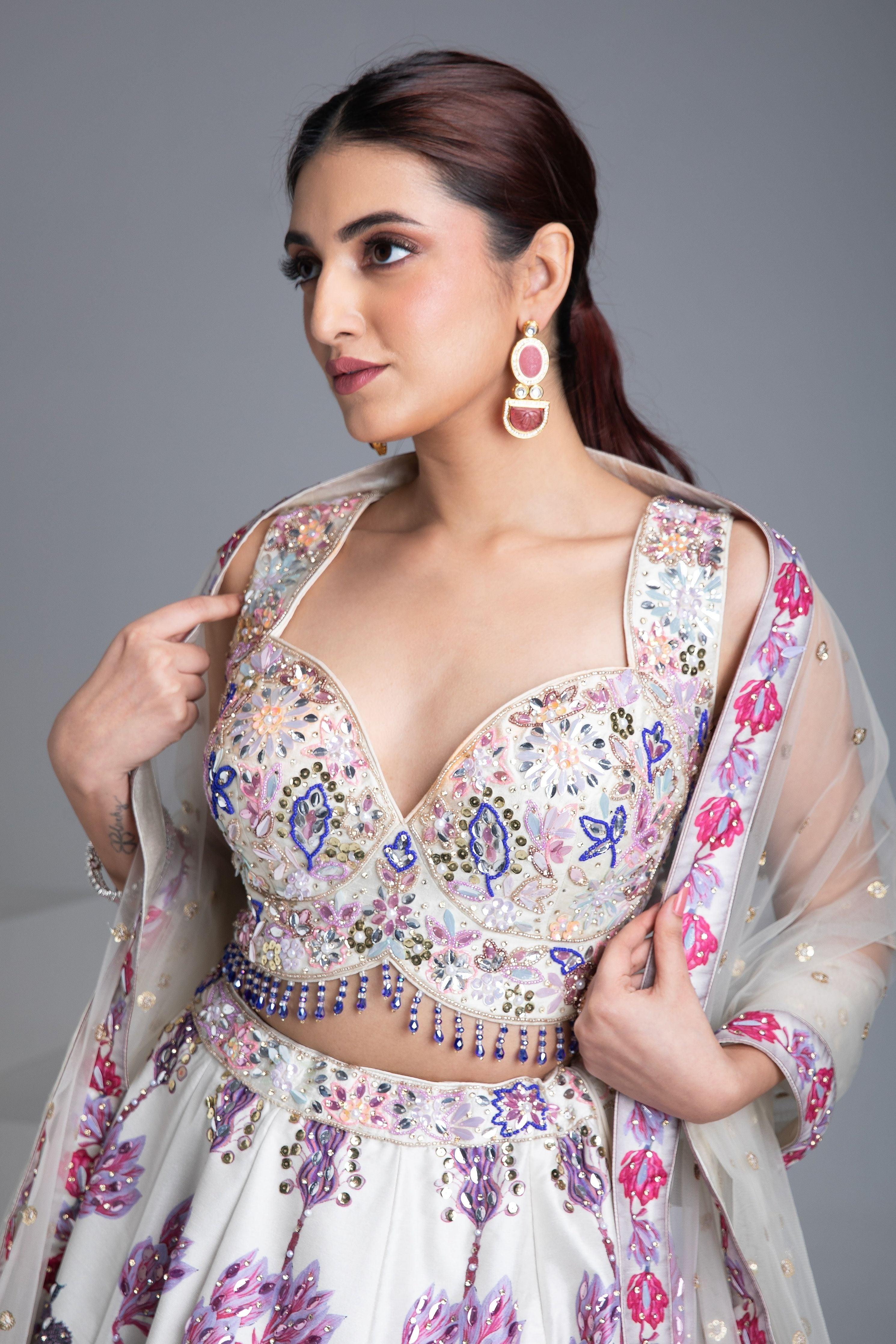 Ivory Silk Lehenga With Multicolor Floral Embroidery And Net Dupatta - Mokshaa