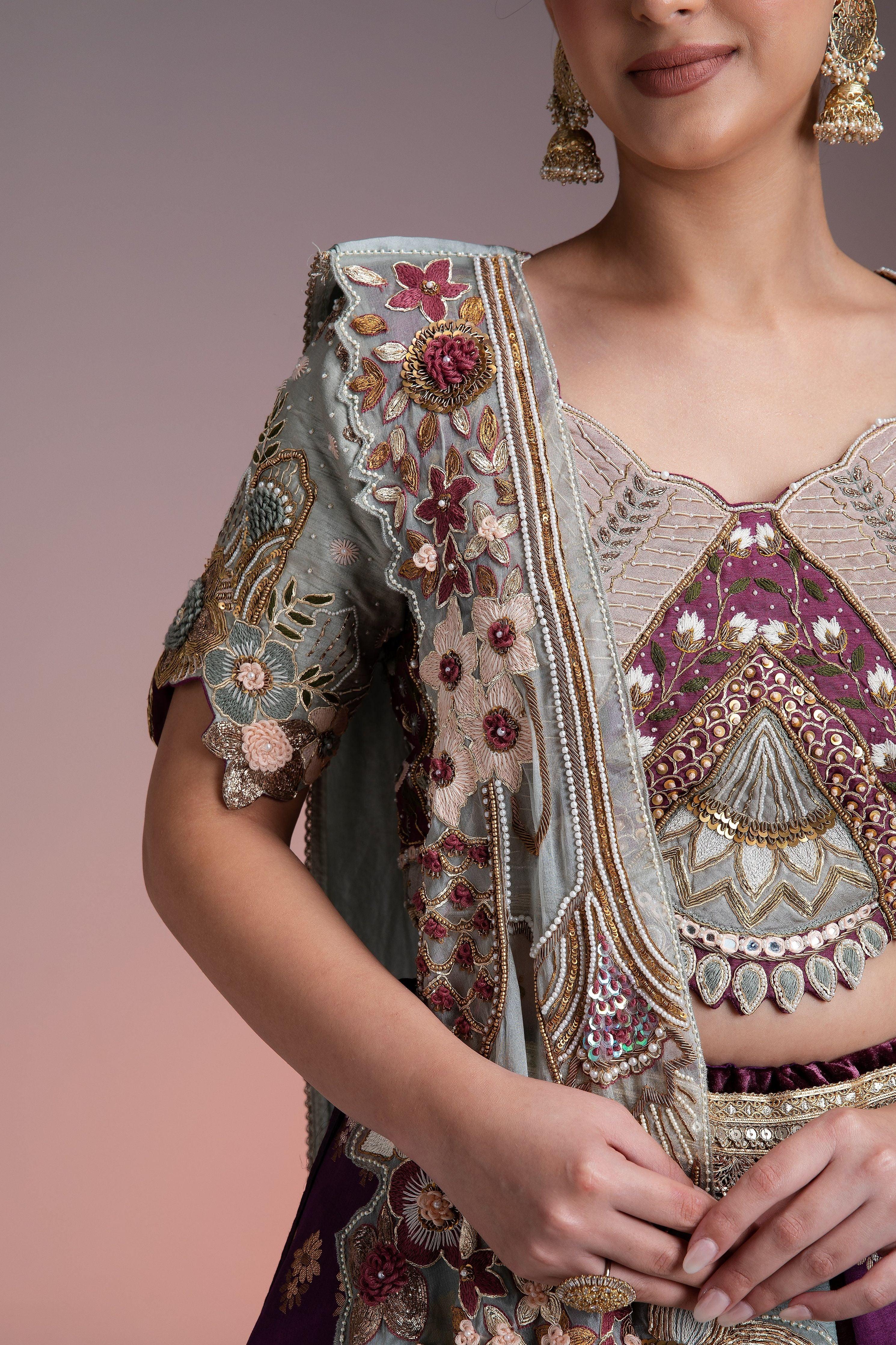 Silk Brocade Lehenga In Muted Pastels And Maroon With Floral Threadwork And Velvet Accents - Mokshaa