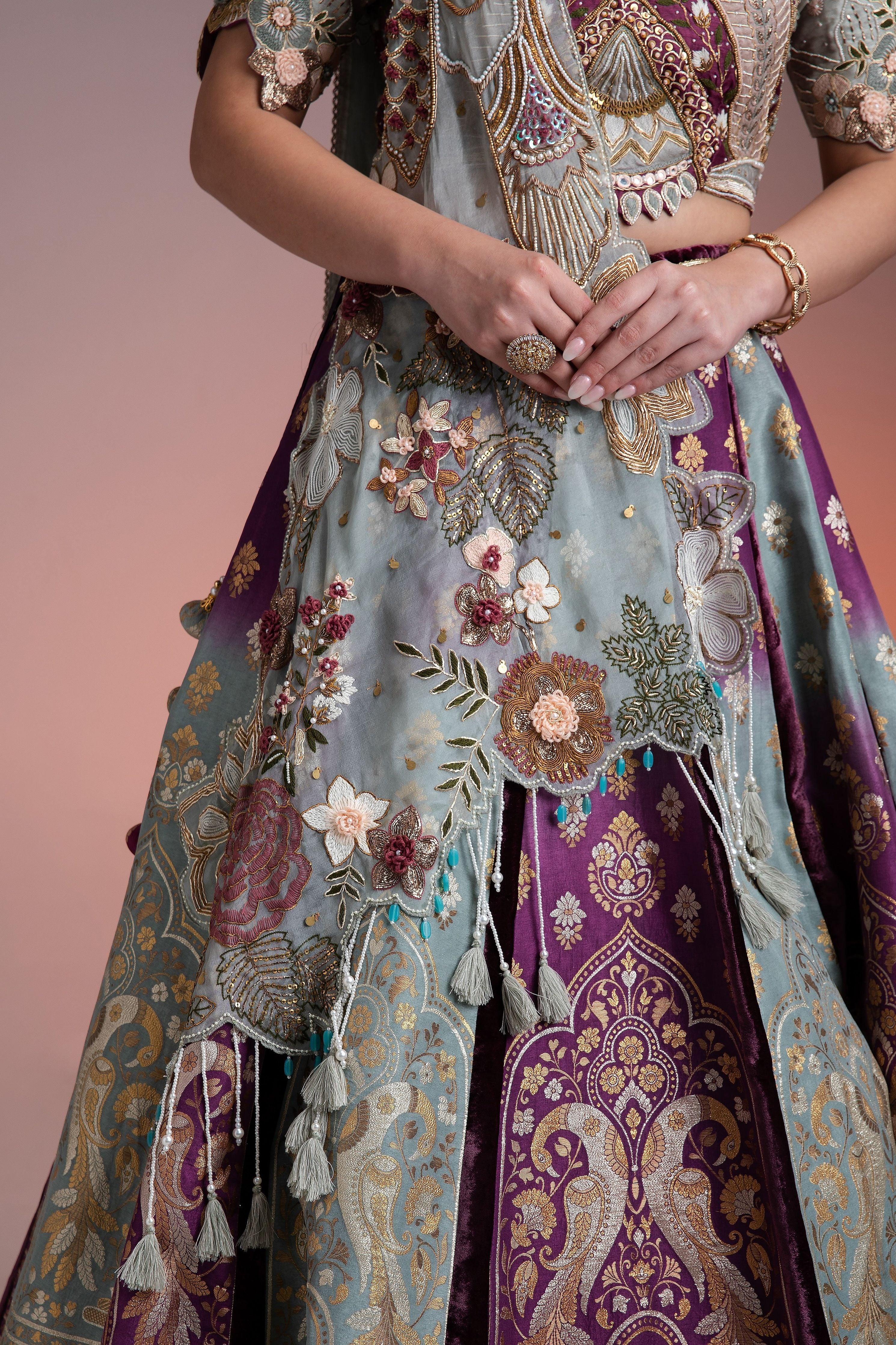Silk Brocade Lehenga In Muted Pastels And Maroon With Floral Threadwork And Velvet Accents - Mokshaa