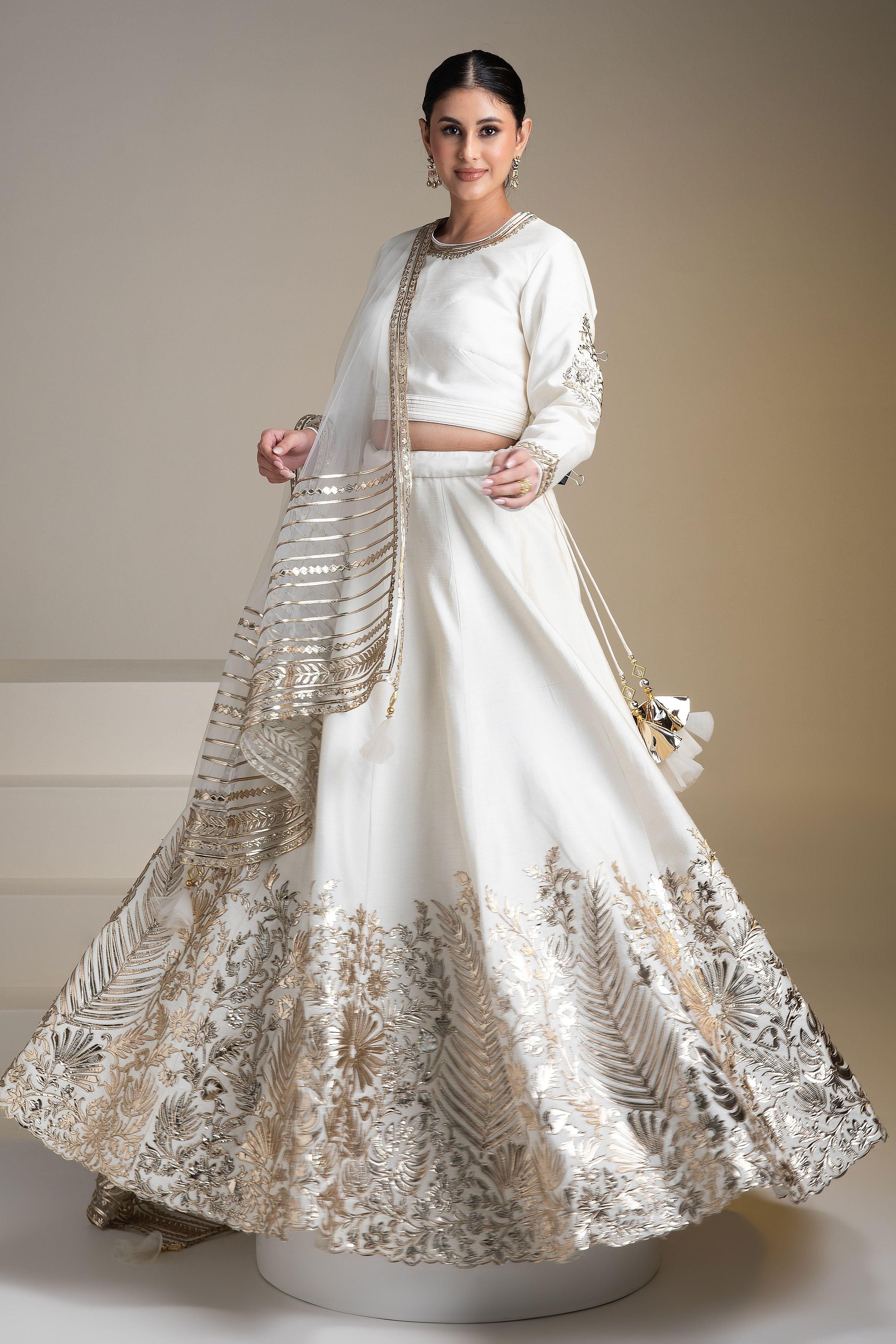 Pristine White Silk Lehenga Set With Metallic Gold Embroidery - Mokshaa