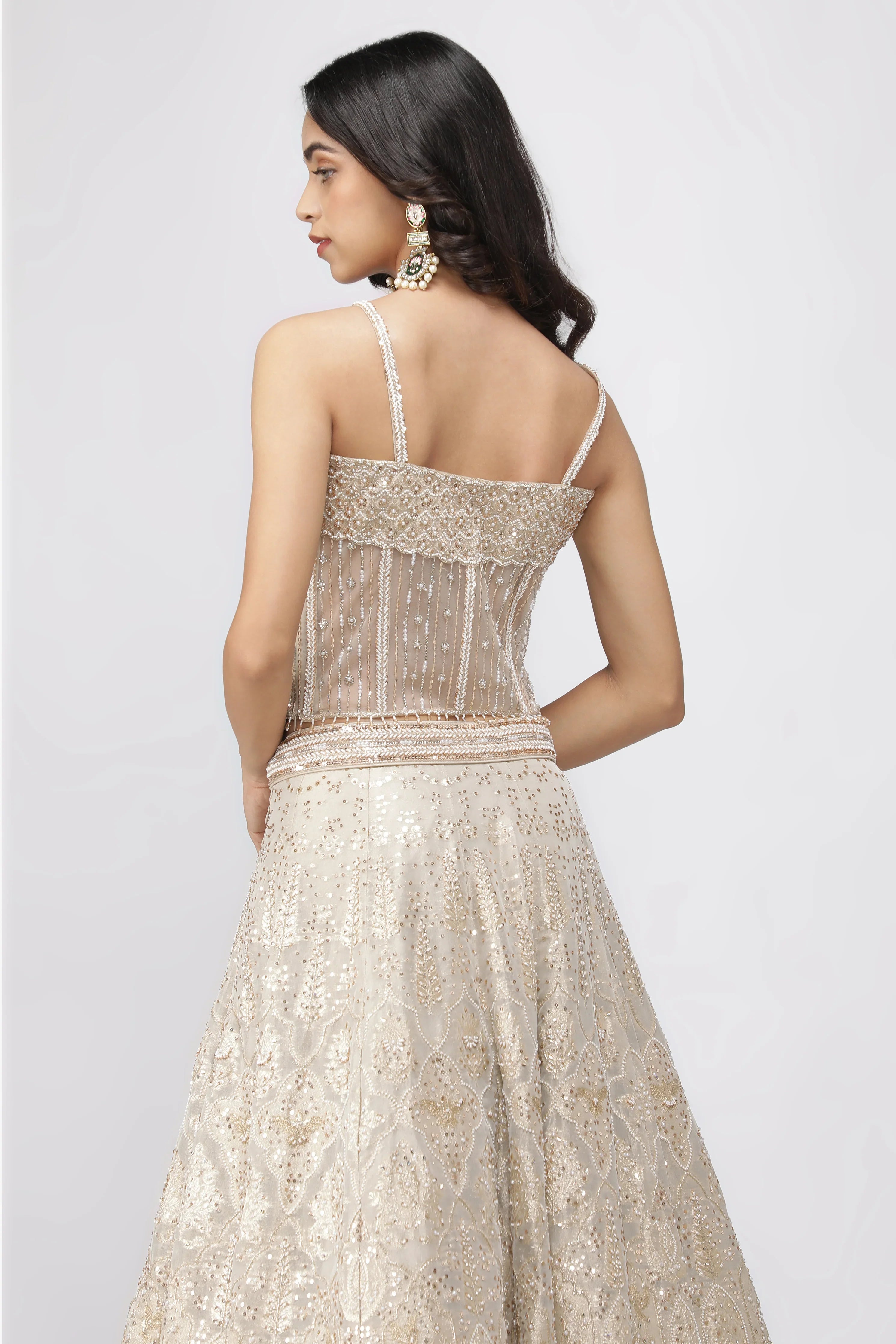 Ivory Banarasi Tissue Lehenga with Pearl Embellished Corset Blouse - Mokshaa