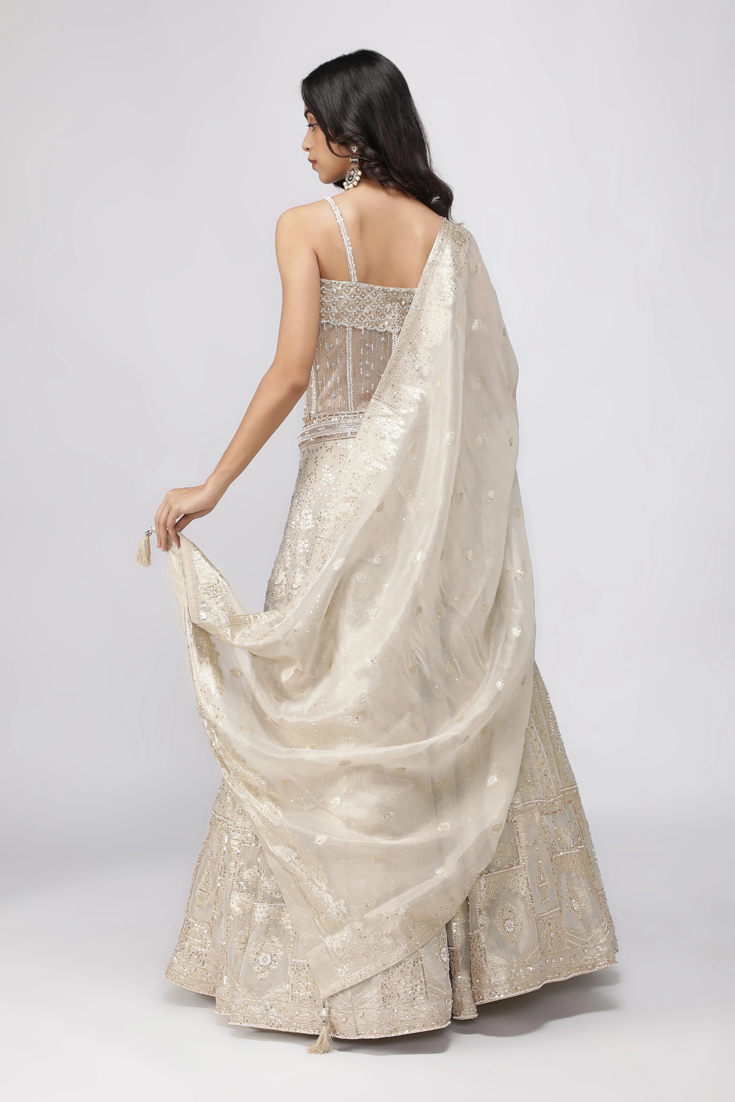 Ivory Banarasi Tissue Lehenga with Pearl Embellished Corset Blouse - Mokshaa
