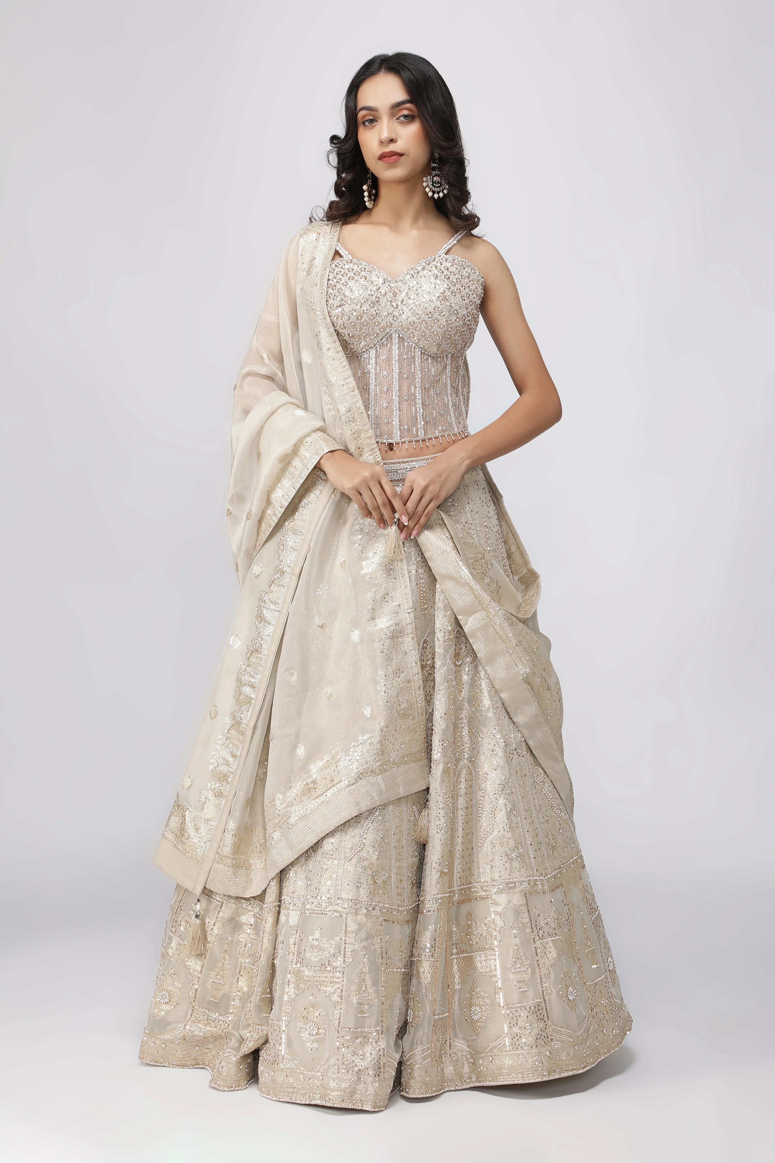 Ivory Banarasi Tissue Lehenga with Pearl Embellished Corset Blouse - Mokshaa