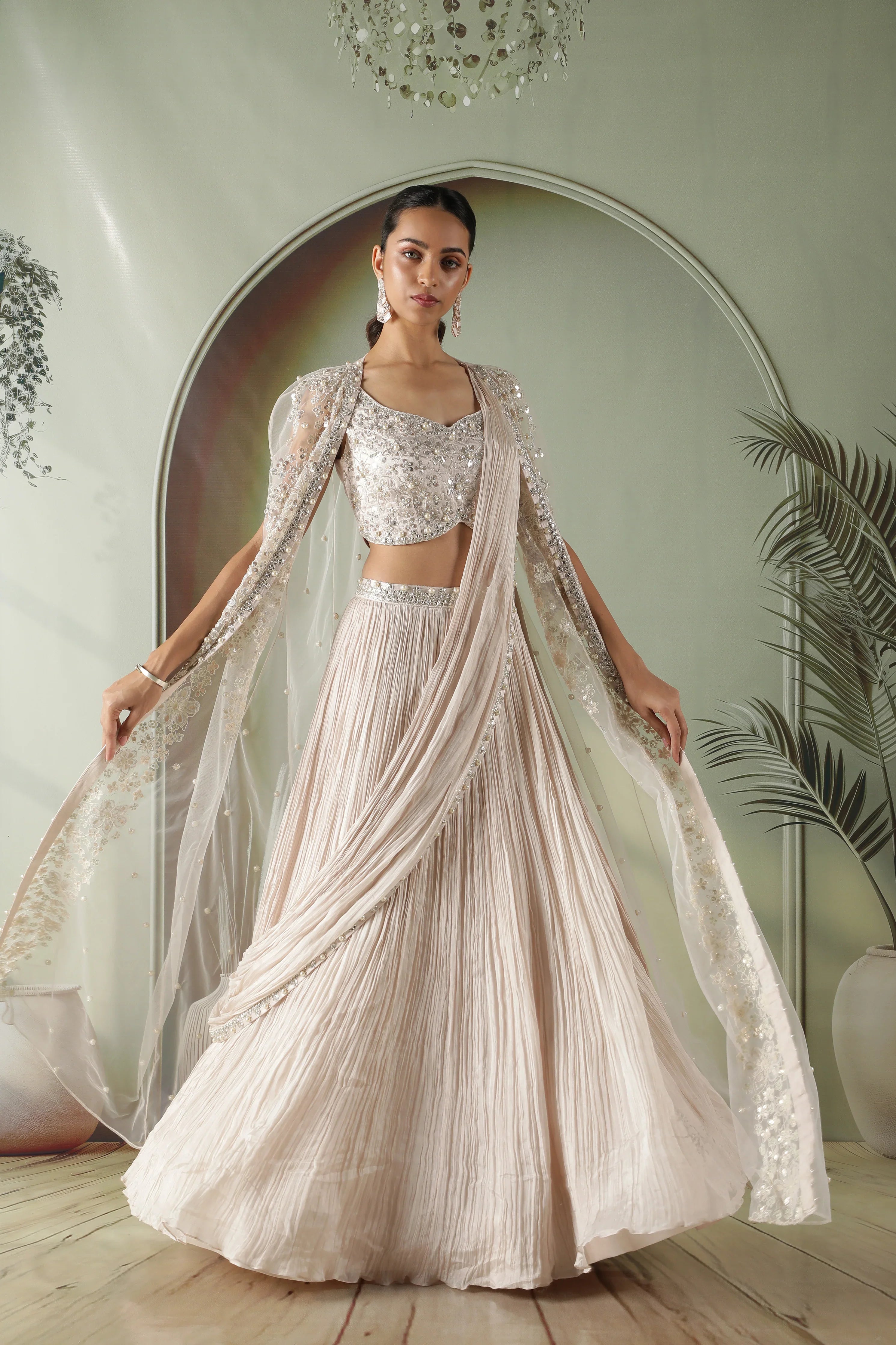 Ivory Silk Lehenga with Draped Dupatta and Embellished Net Cape - Mokshaa