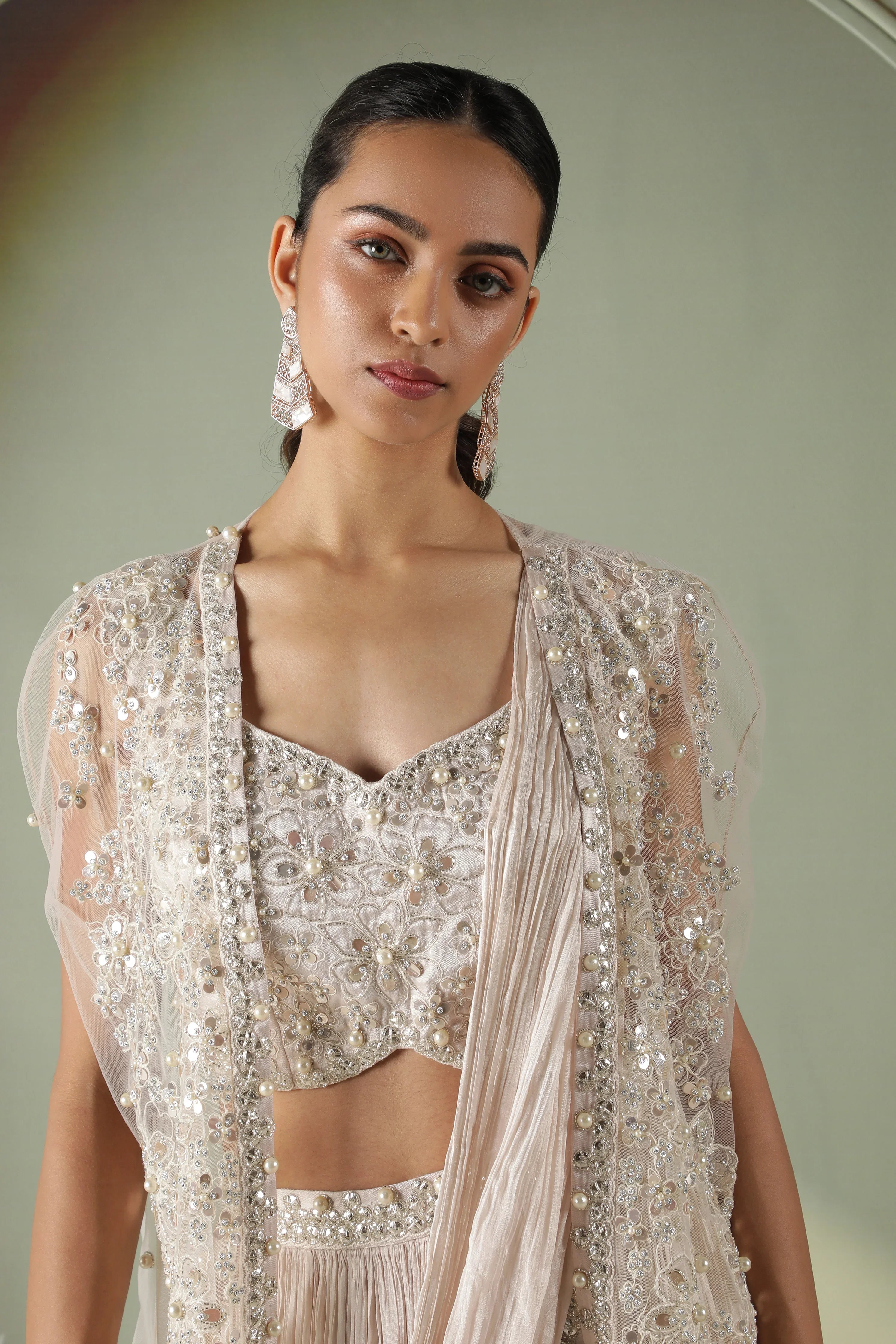 Ivory Silk Lehenga with Draped Dupatta and Embellished Net Cape - Mokshaa