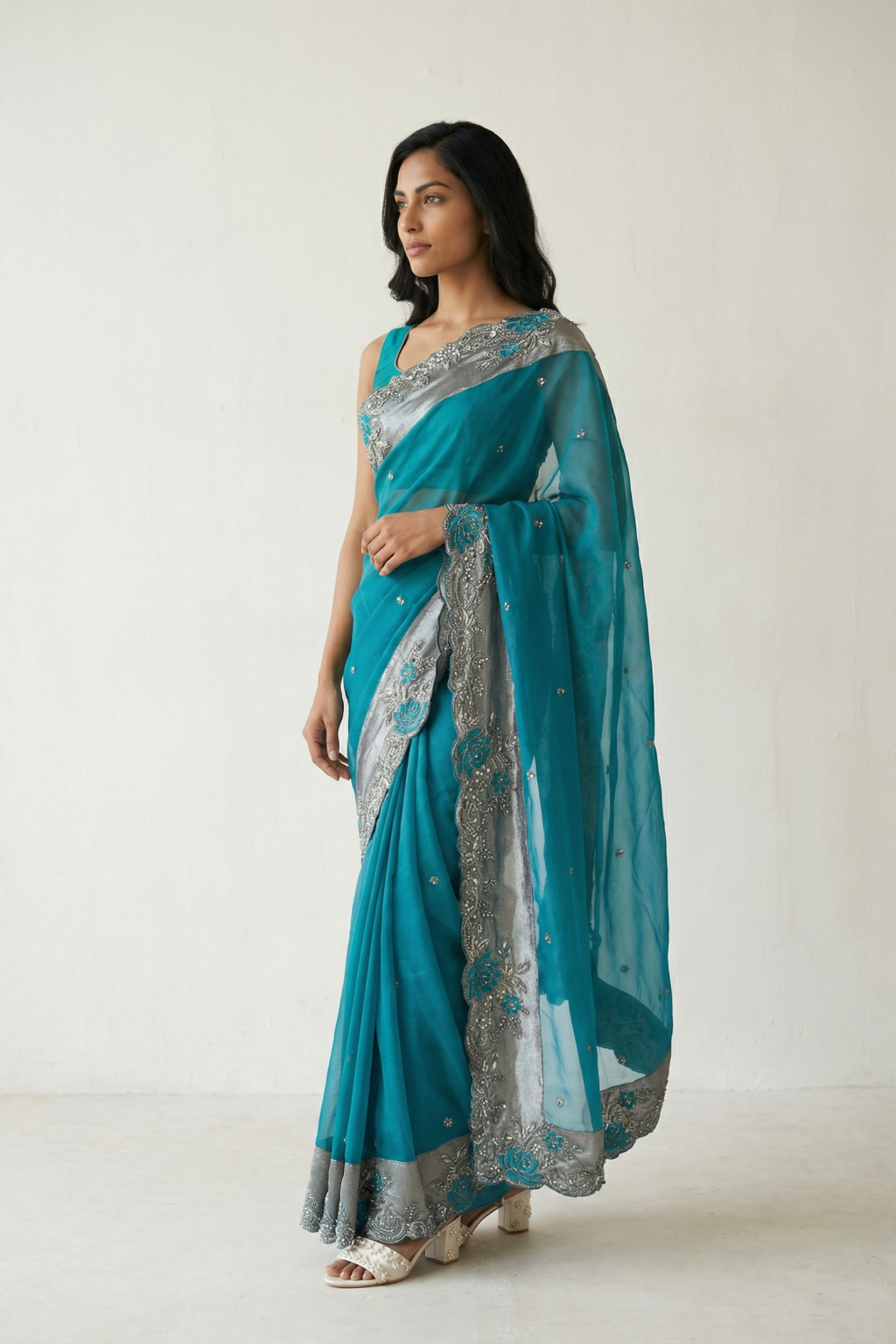 Emerald Green Organza Saree with Antique Sequins & Beaded Tissue Border