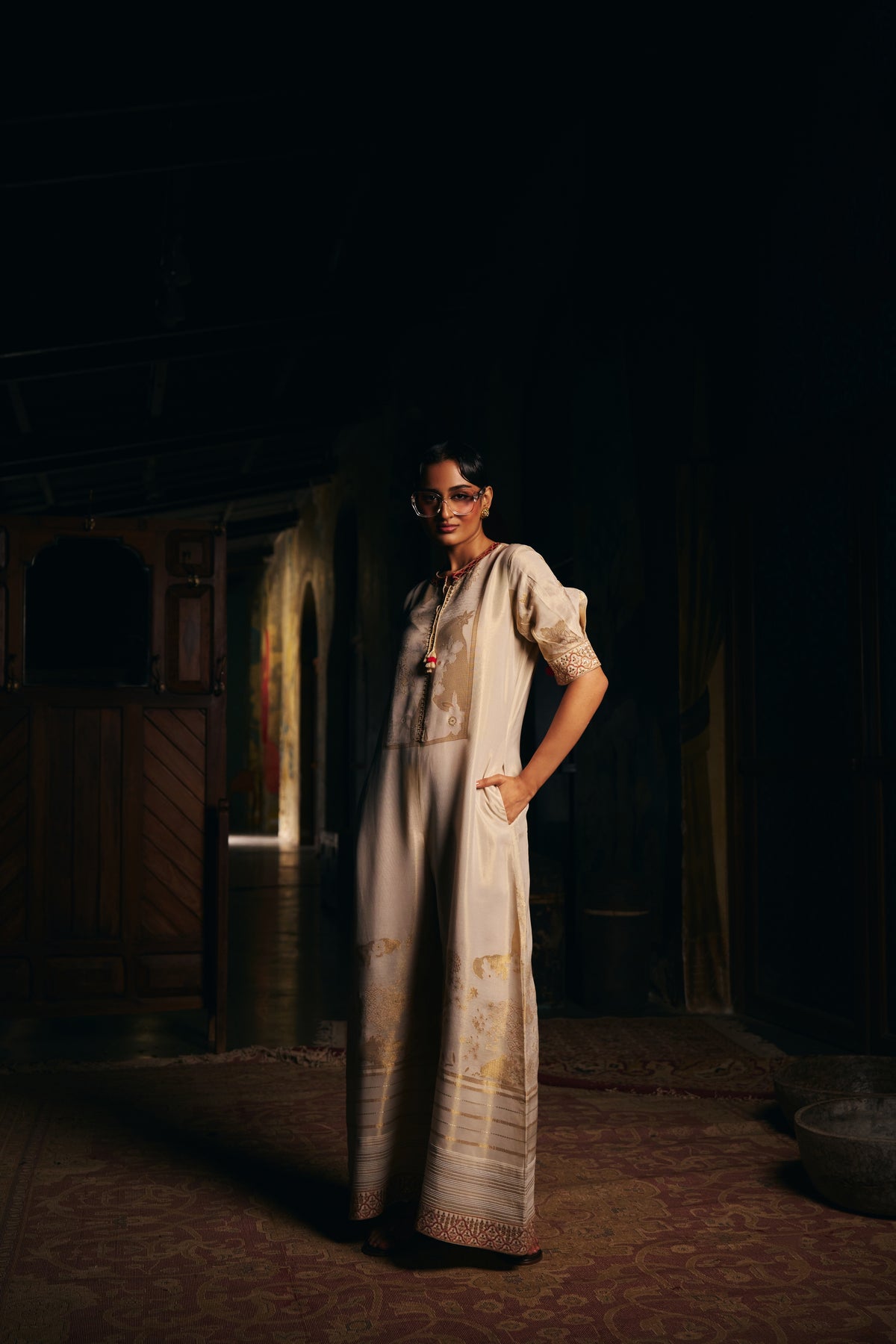 Ivory Banarasi Tissue Jumpsuit with Gold Woven Motifs and Embroidered Neckline - Mokshaa