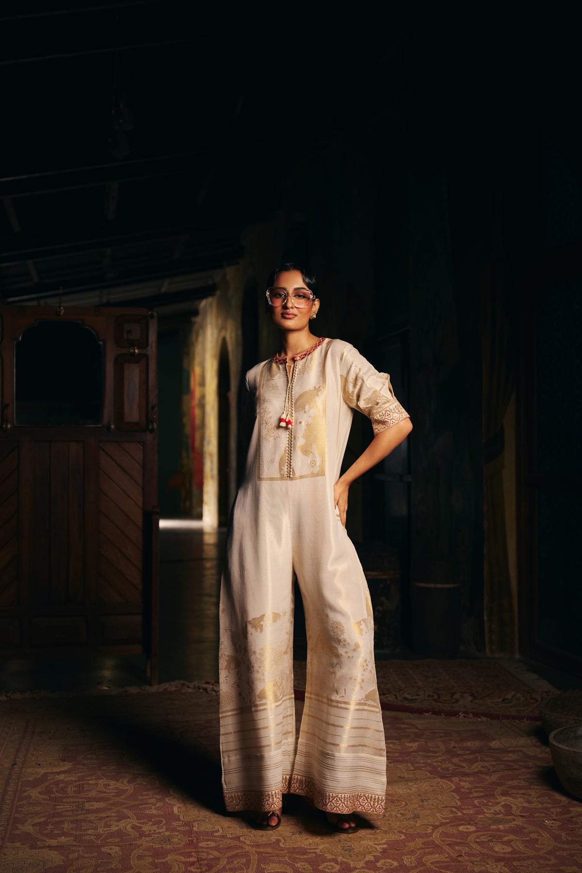 Ivory Banarasi Tissue Jumpsuit with Gold Woven Motifs and Embroidered Neckline - Mokshaa