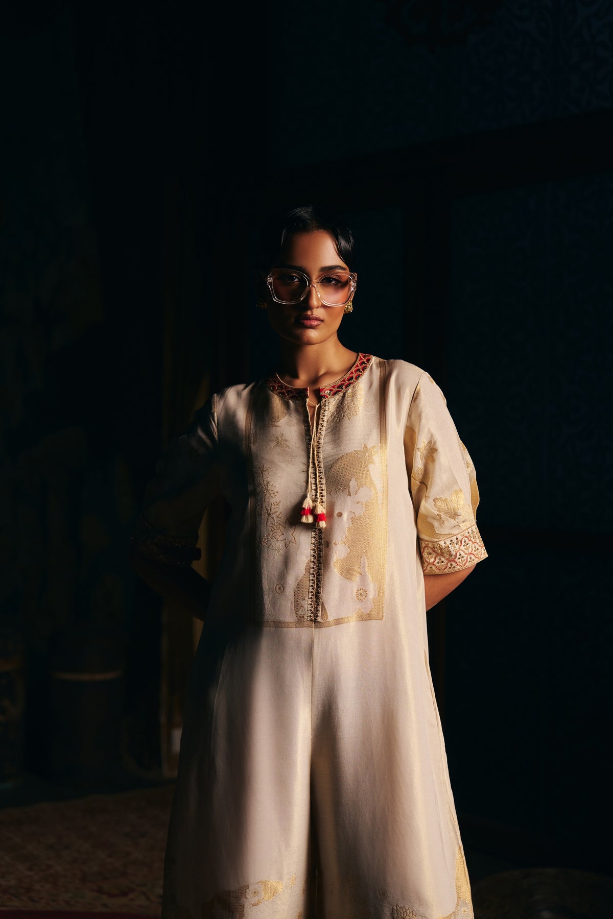 Ivory Banarasi Tissue Jumpsuit with Gold Woven Motifs and Embroidered Neckline - Mokshaa