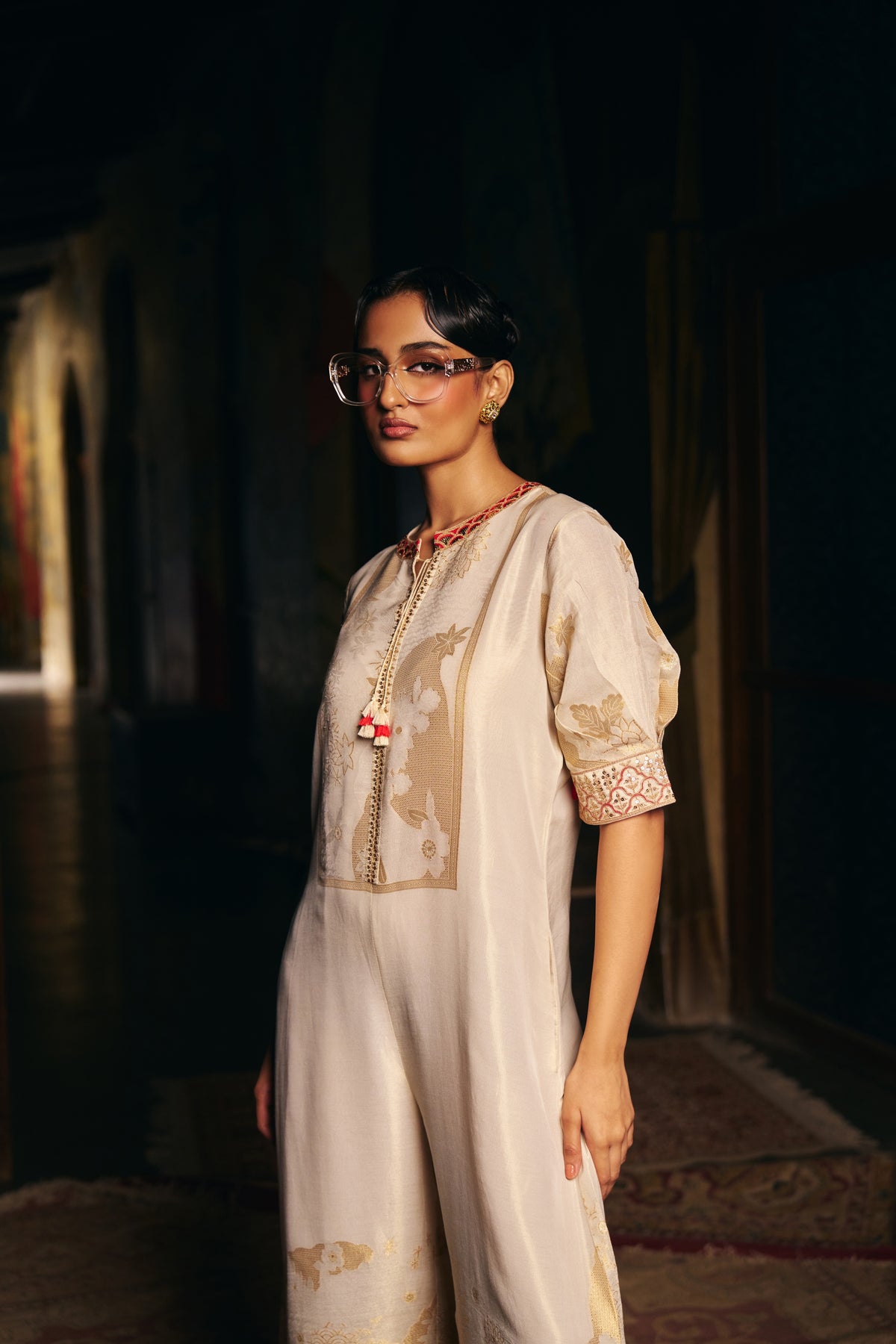 Ivory Banarasi Tissue Jumpsuit with Gold Woven Motifs and Embroidered Neckline - Mokshaa