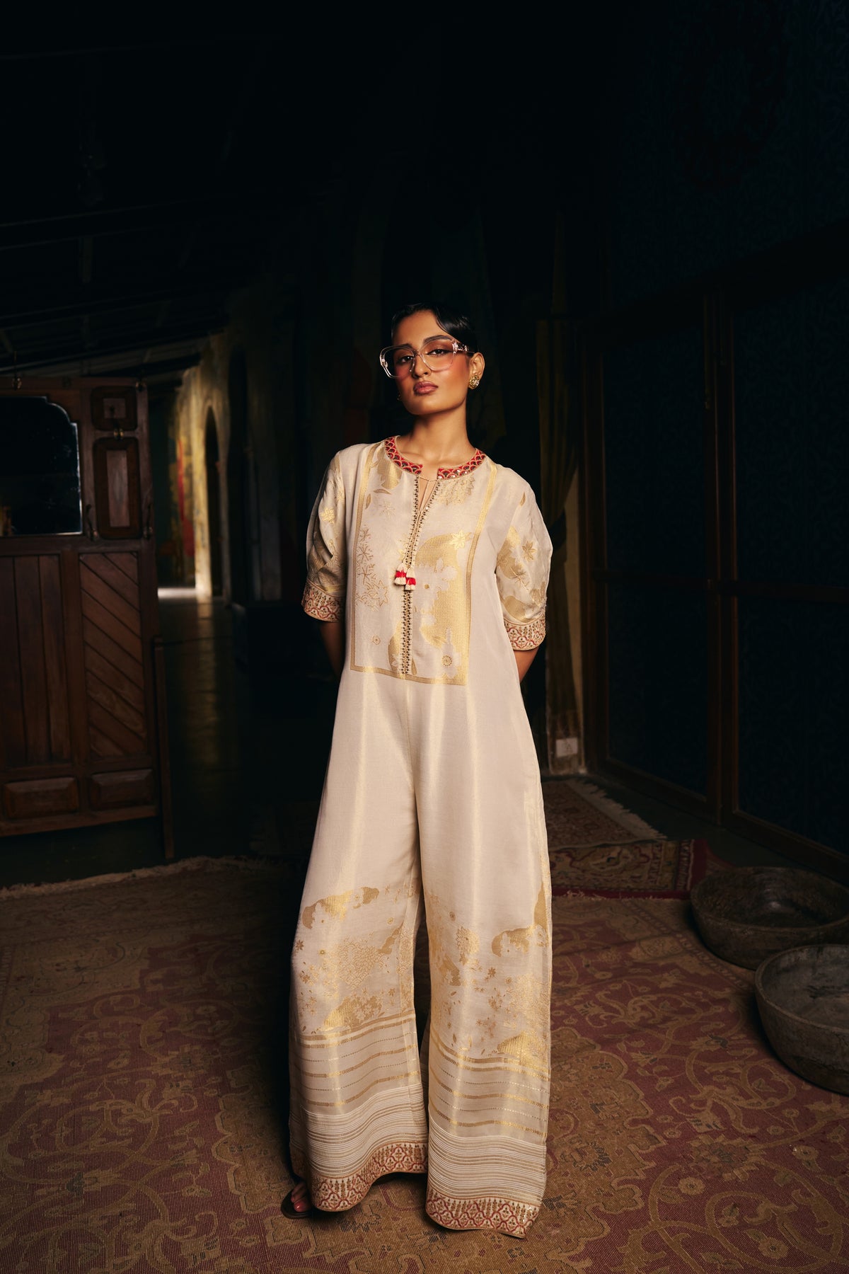 Ivory Banarasi Tissue Jumpsuit with Gold Woven Motifs and Embroidered Neckline - Mokshaa