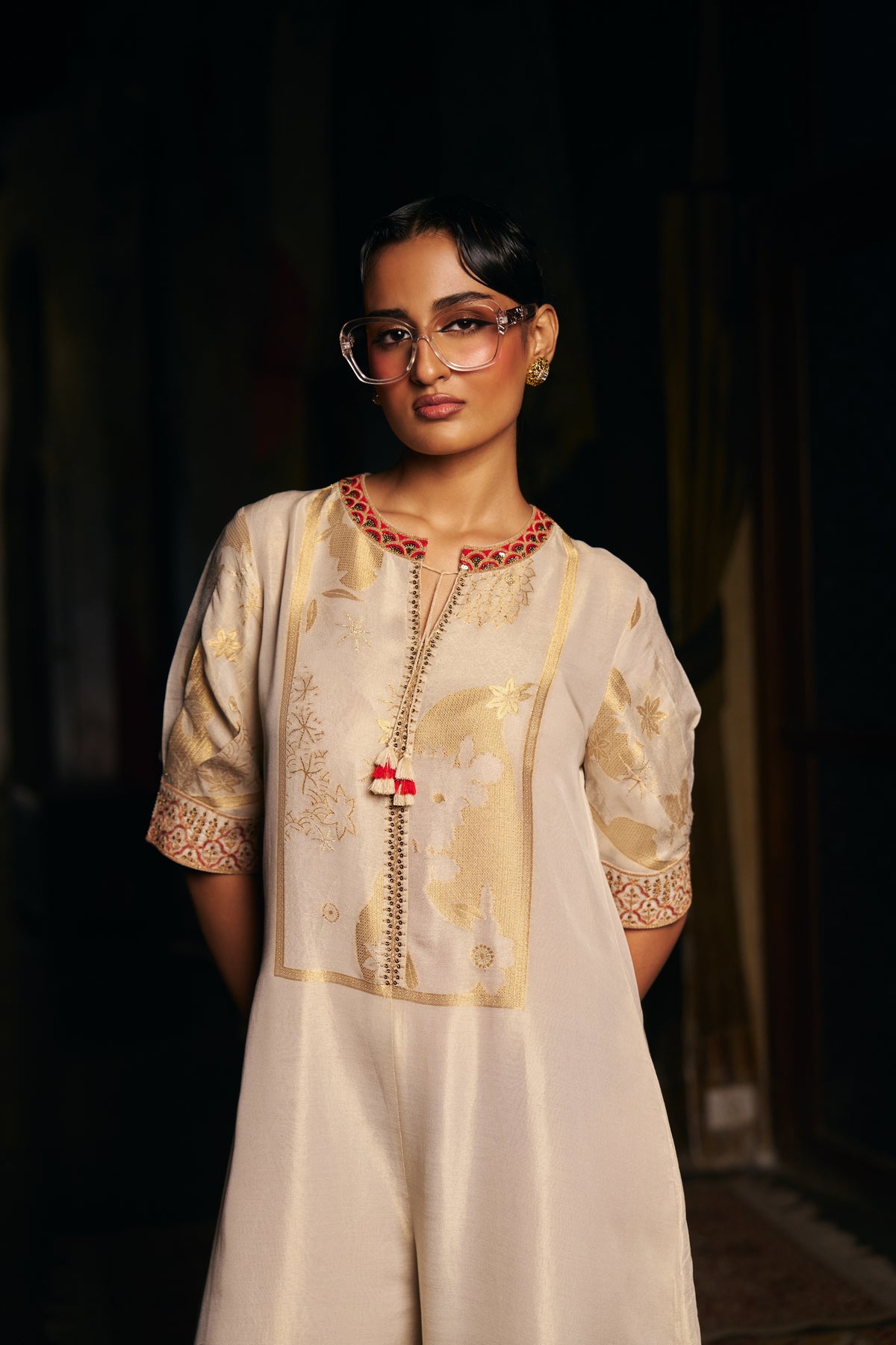 Ivory Banarasi Tissue Jumpsuit with Gold Woven Motifs and Embroidered Neckline - Mokshaa
