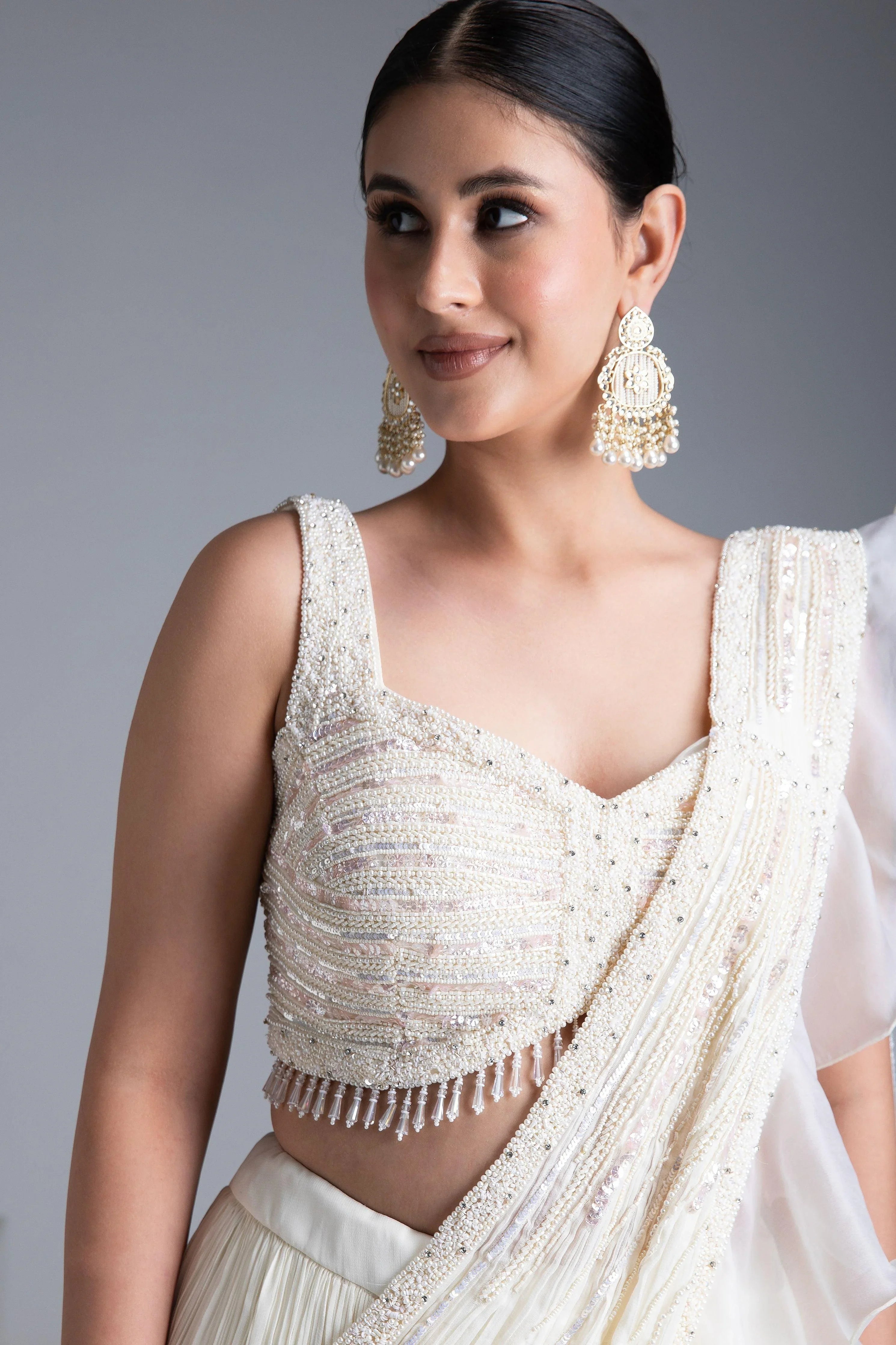Ivory Georgette Pleated Lehenga Set With Bead And Pearl Embroidered Blouse - Mokshaa