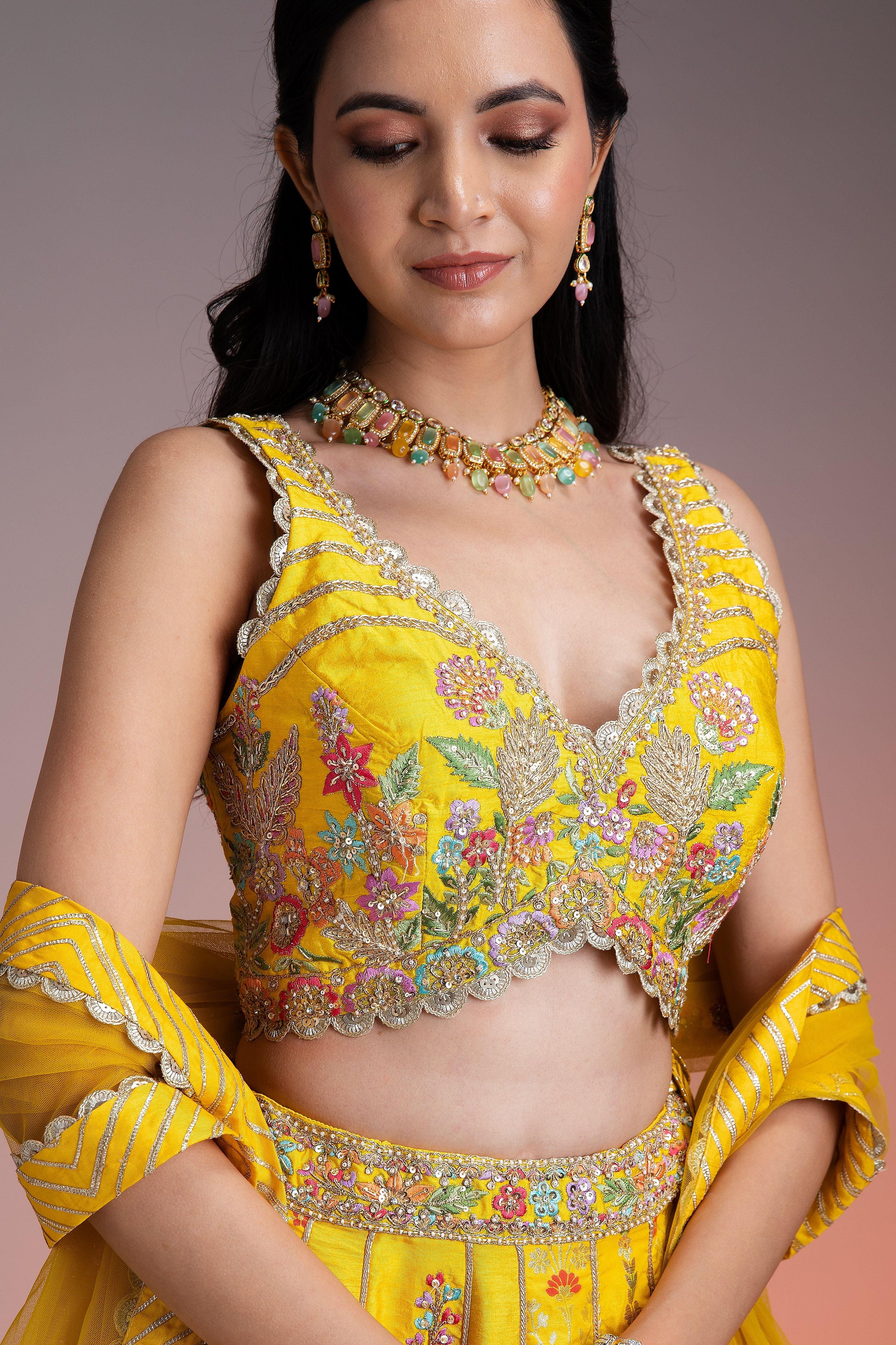 Bright Yellow Silk Lehenga With Multicolor Floral Threadwork And Net Dupatta - Mokshaa