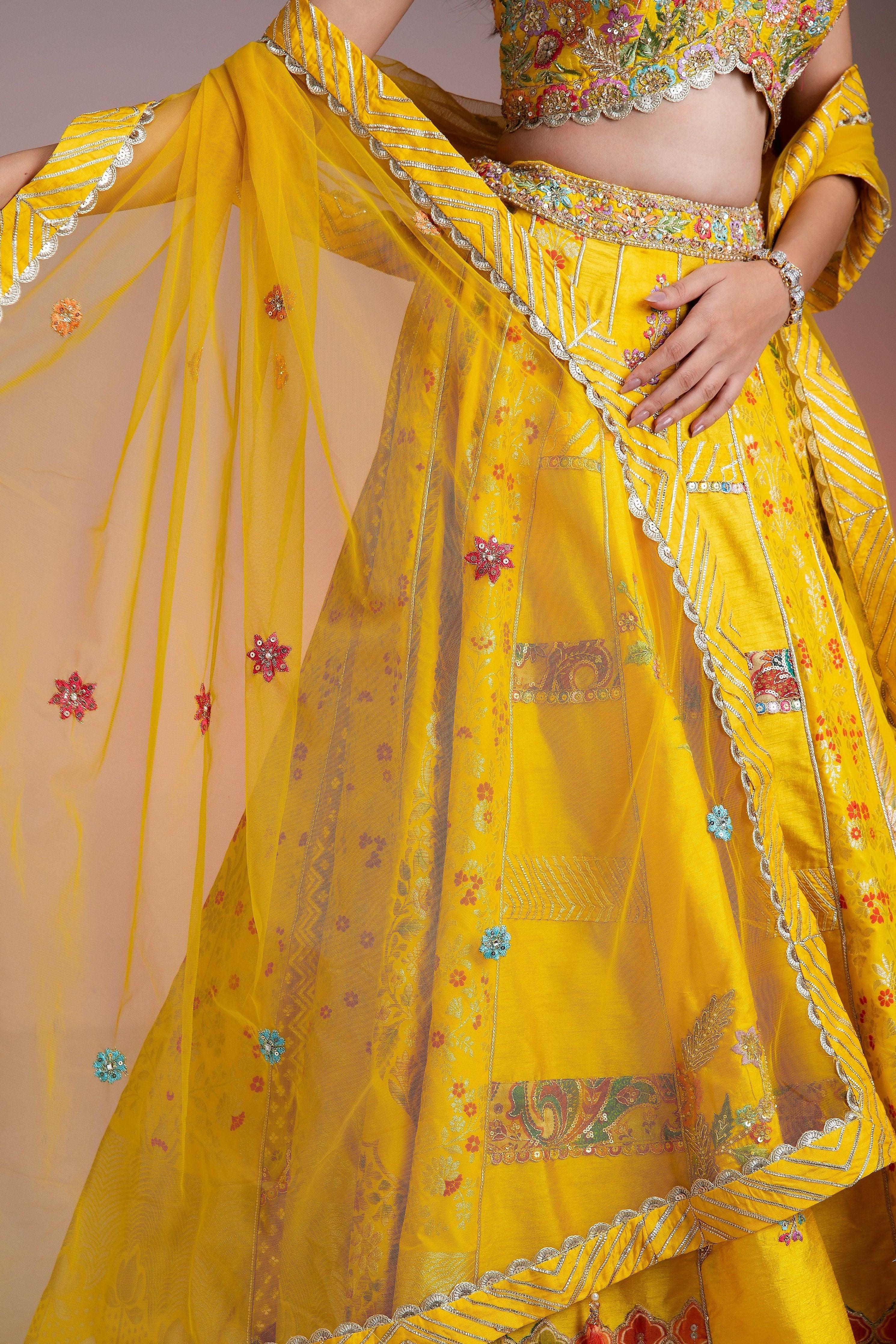 Bright Yellow Silk Lehenga With Multicolor Floral Threadwork And Net Dupatta - Mokshaa