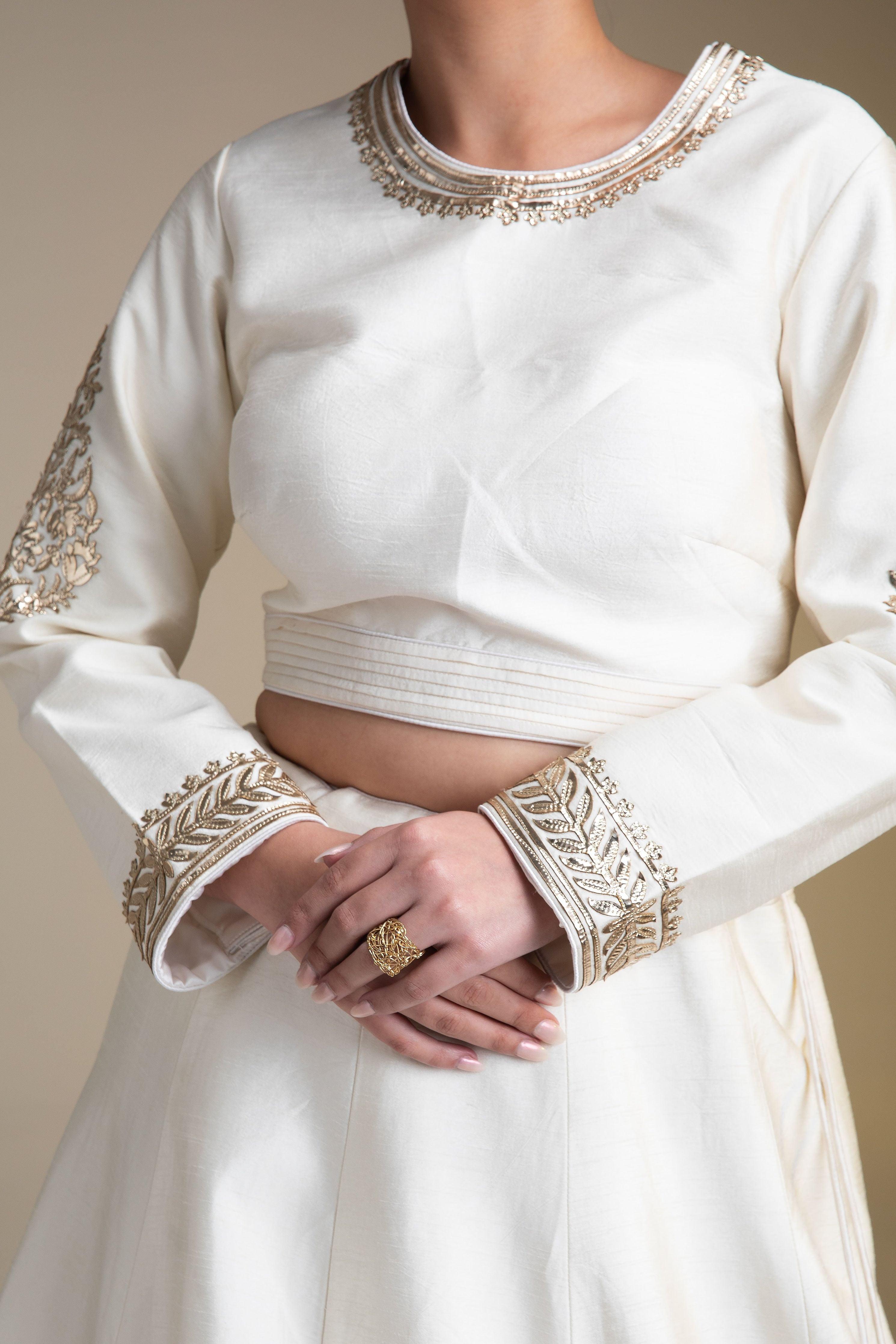 Pristine White Silk Lehenga Set With Metallic Gold Embroidery - Mokshaa