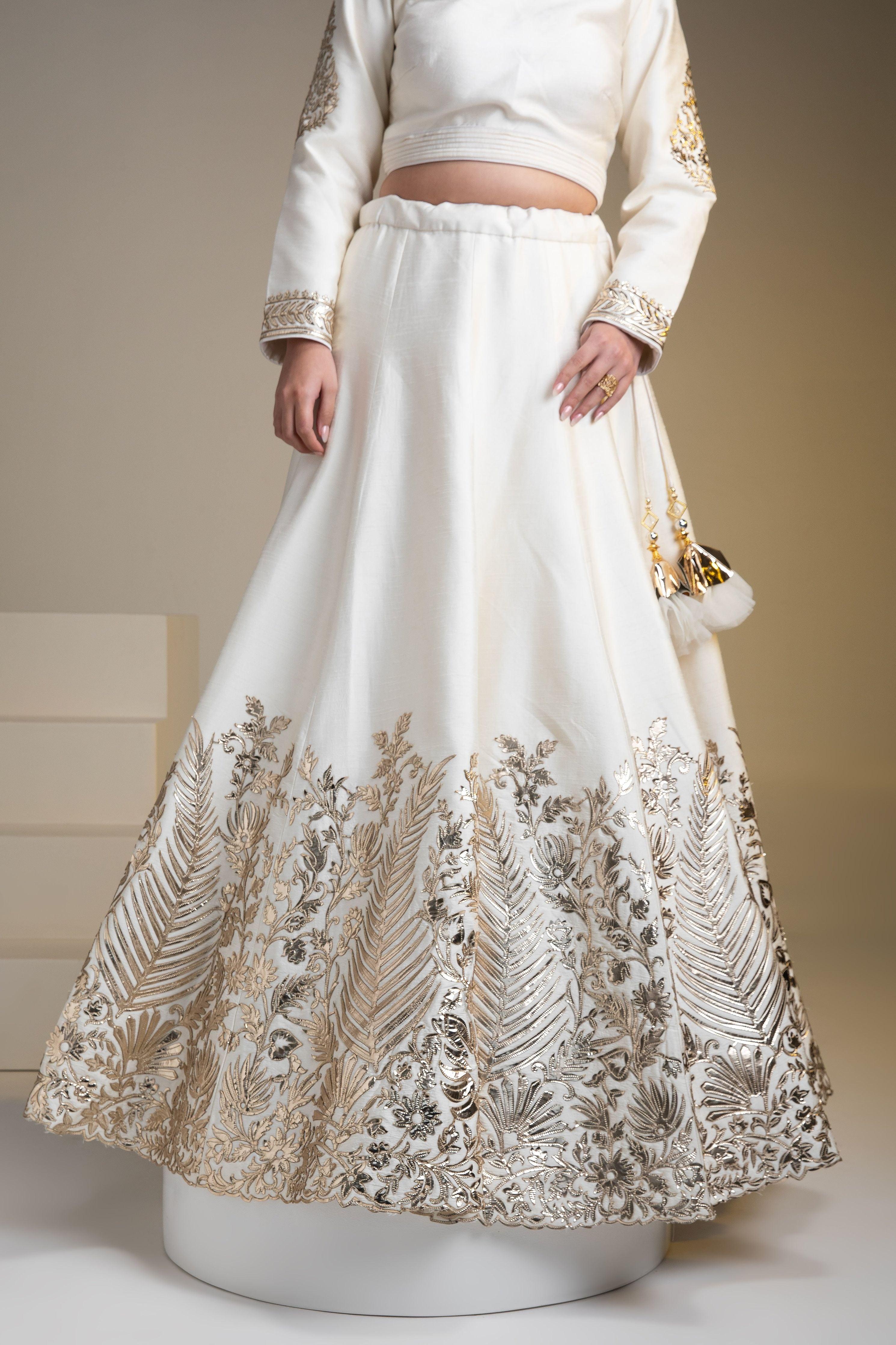 Pristine White Silk Lehenga Set With Metallic Gold Embroidery - Mokshaa