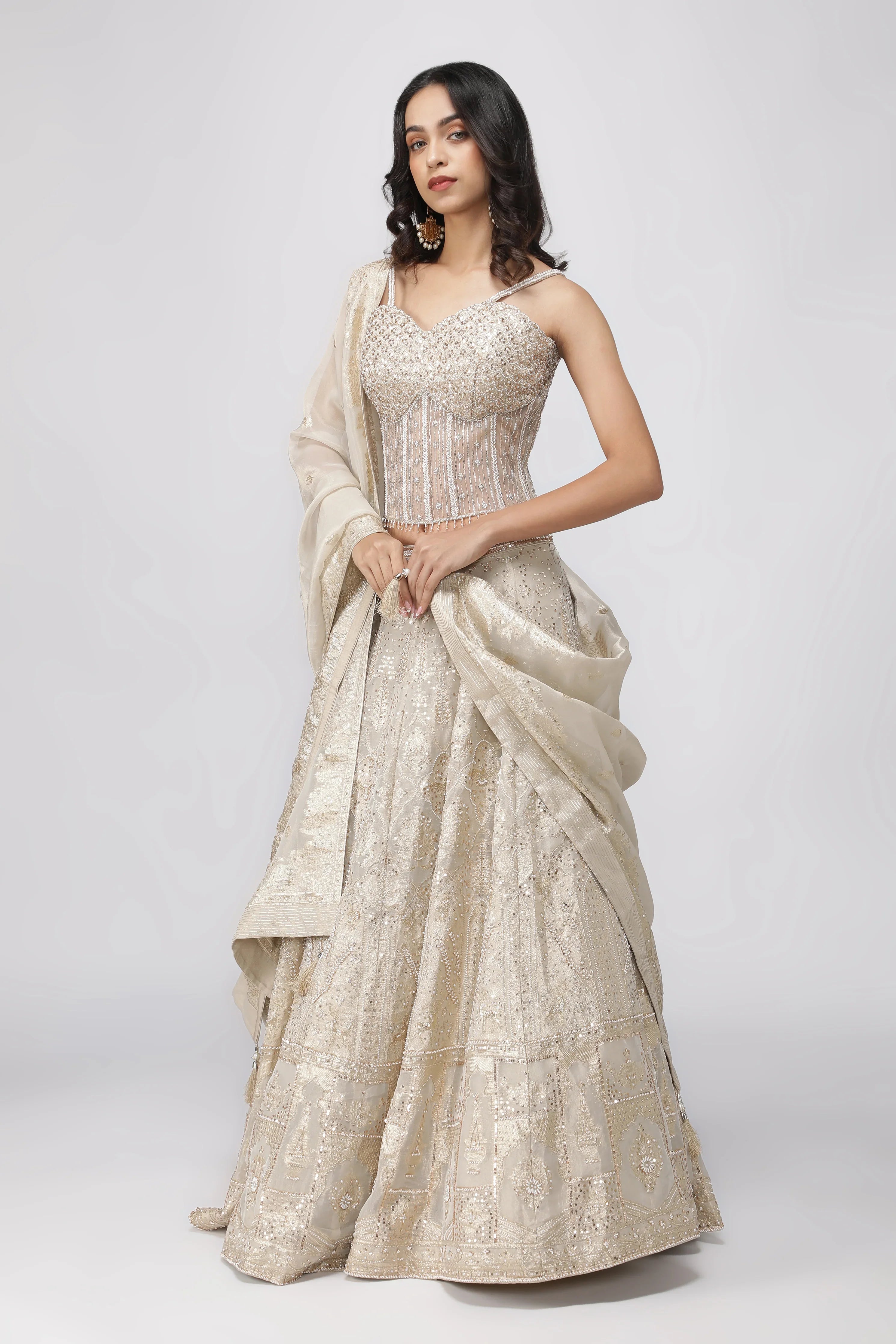 Ivory Banarasi Tissue Lehenga with Pearl Embellished Corset Blouse - Mokshaa