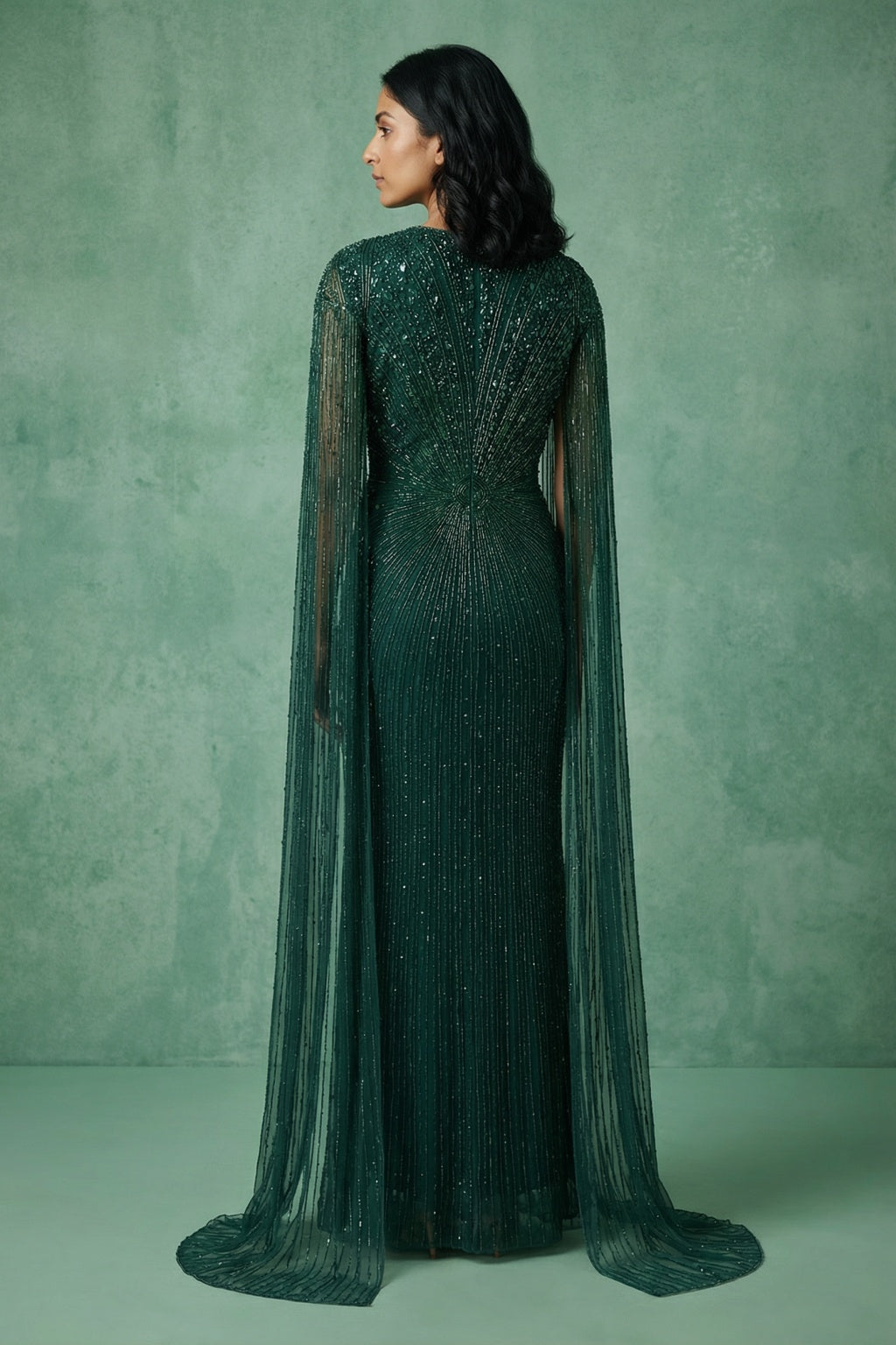 Bottle Green Net Mermaid Gown with Cape Sleeves - Mokshaa