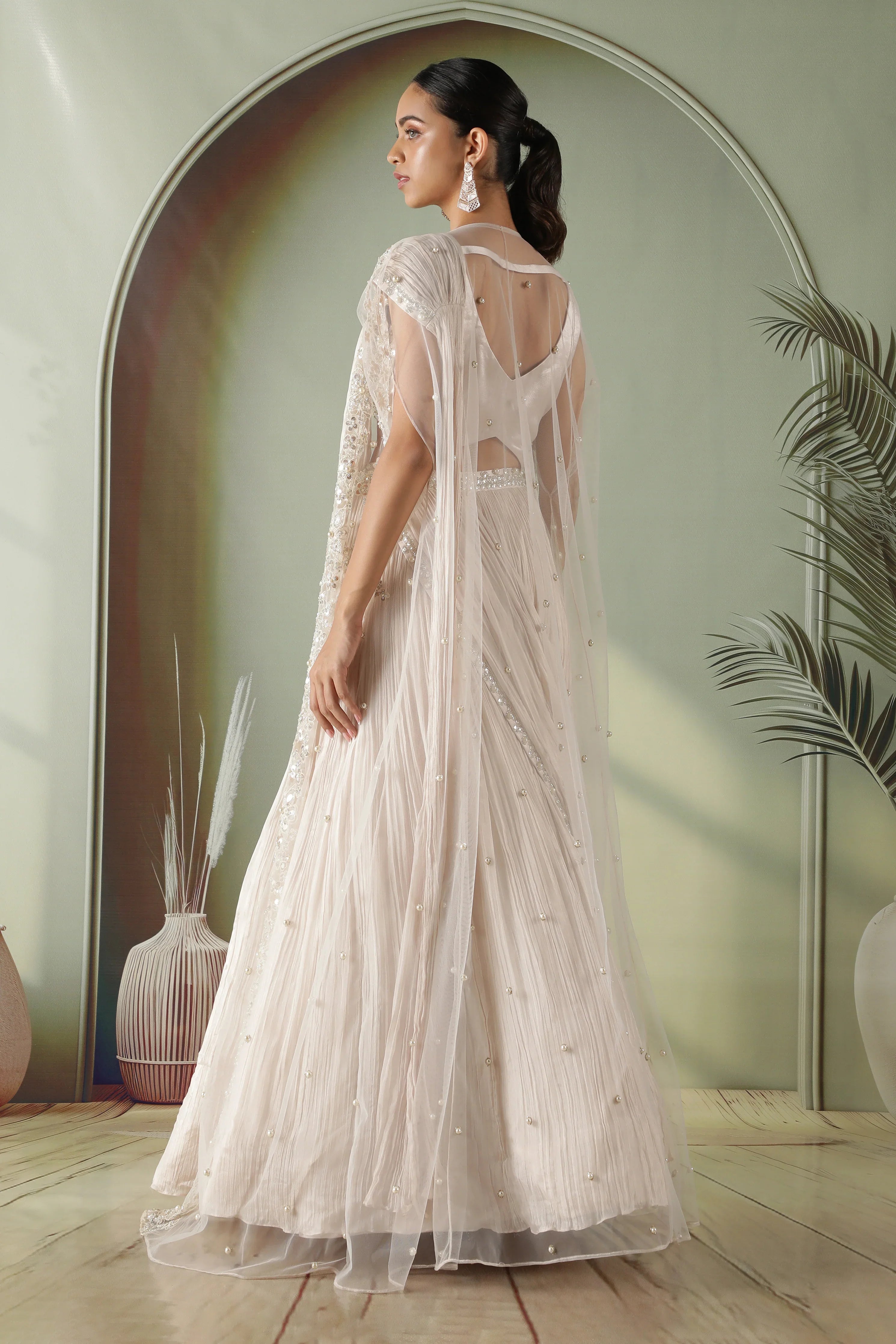 Ivory Silk Lehenga with Draped Dupatta and Embellished Net Cape - Mokshaa