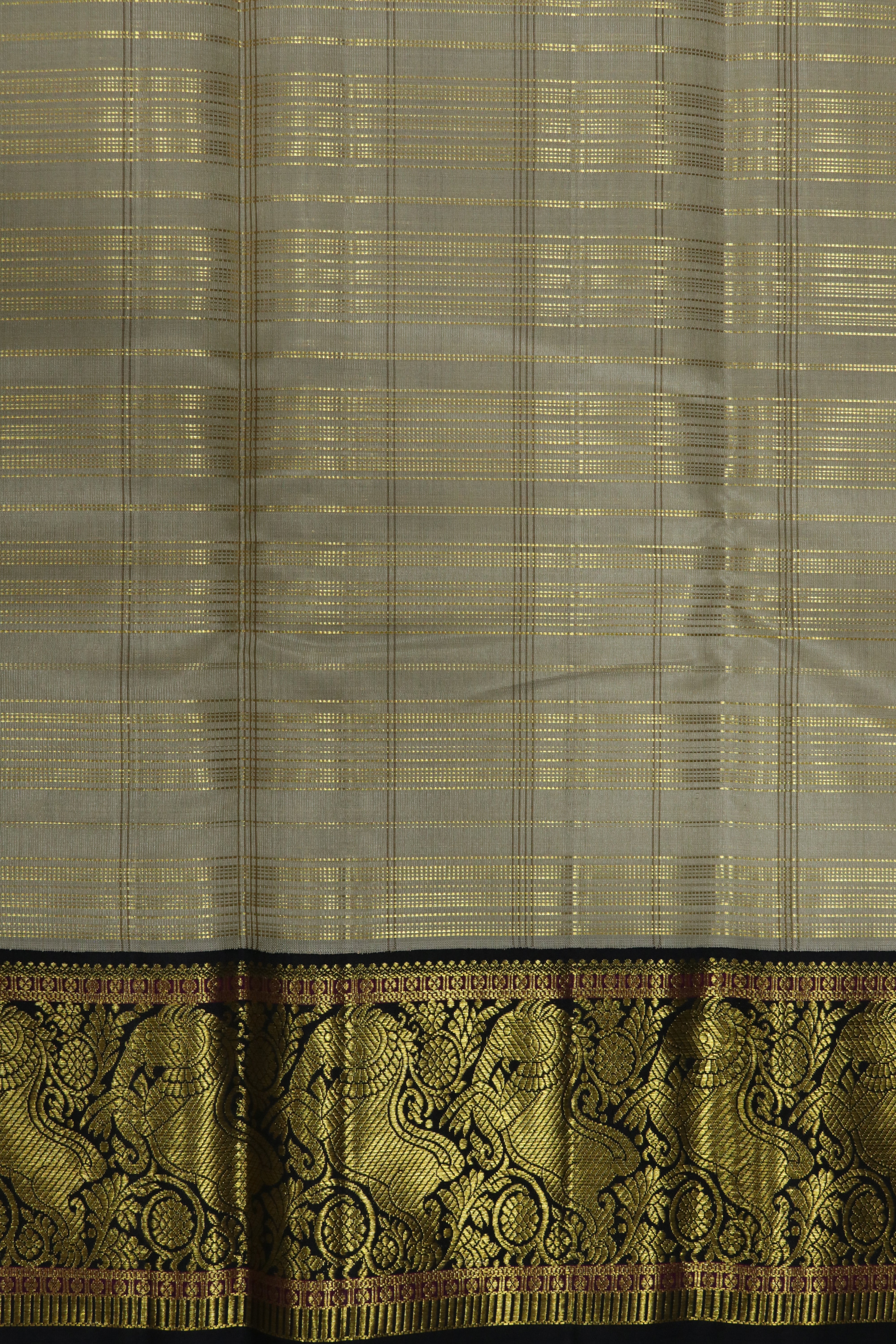 Beige Kanchivaram Silk Saree and Contrast Black Zari Border