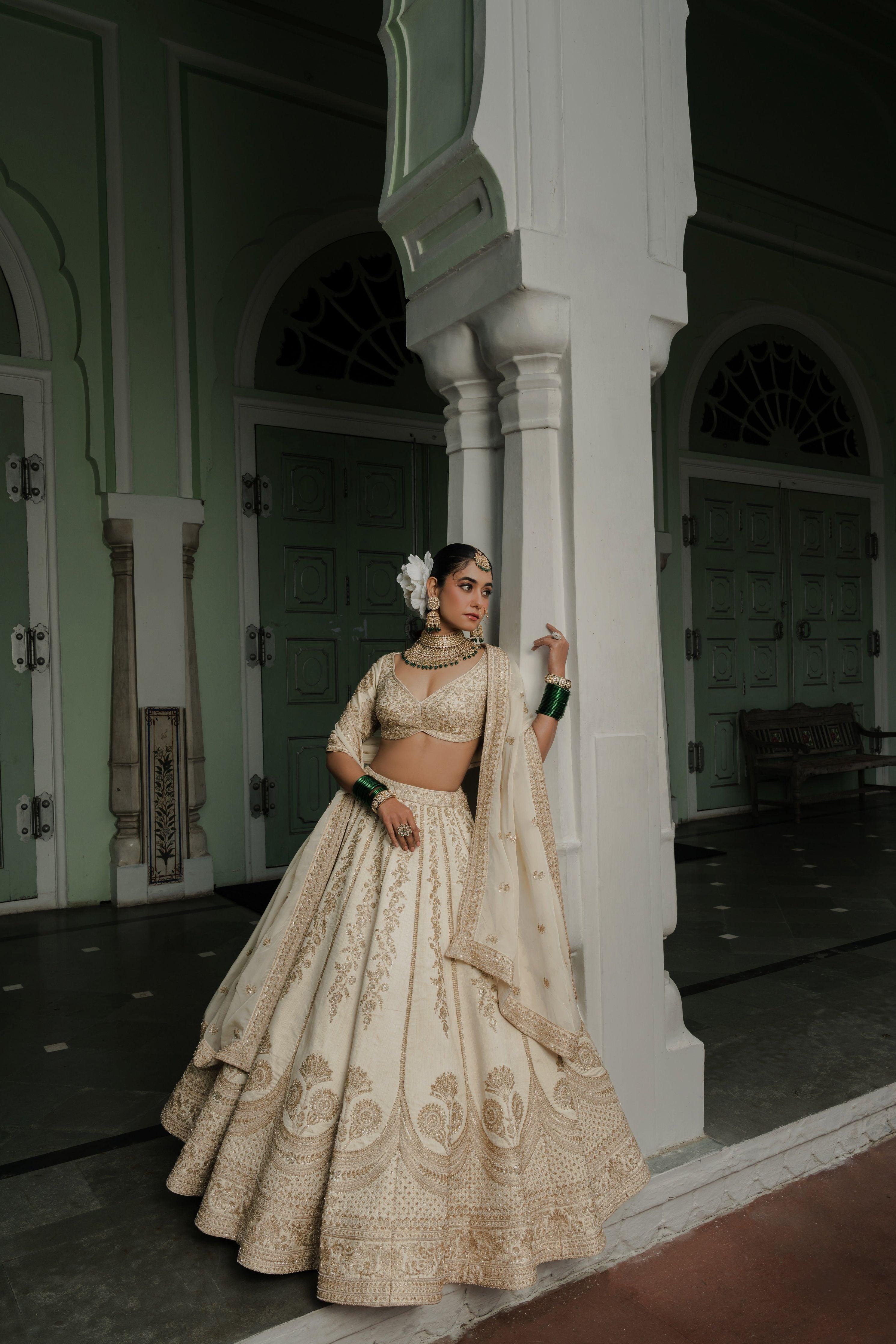 Ivory Raw Silk Lehenga with Antique Zardosi Embroidery - Mokshaa