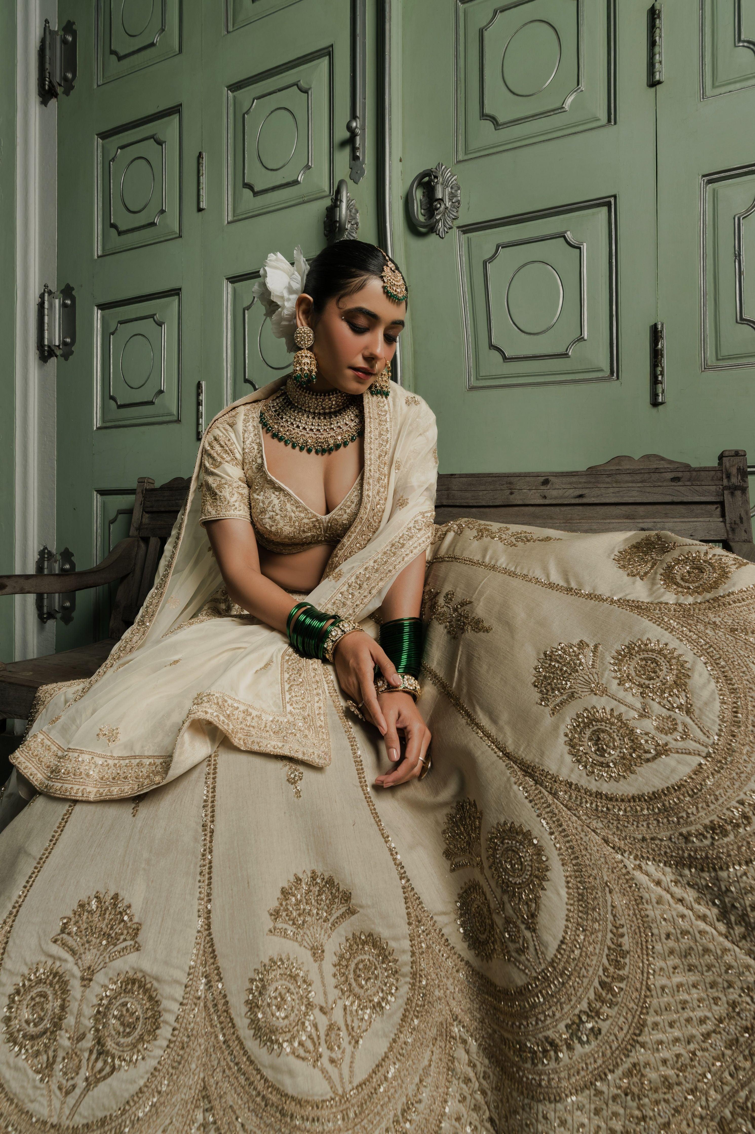 Ivory Raw Silk Lehenga with Antique Zardosi Embroidery - Mokshaa