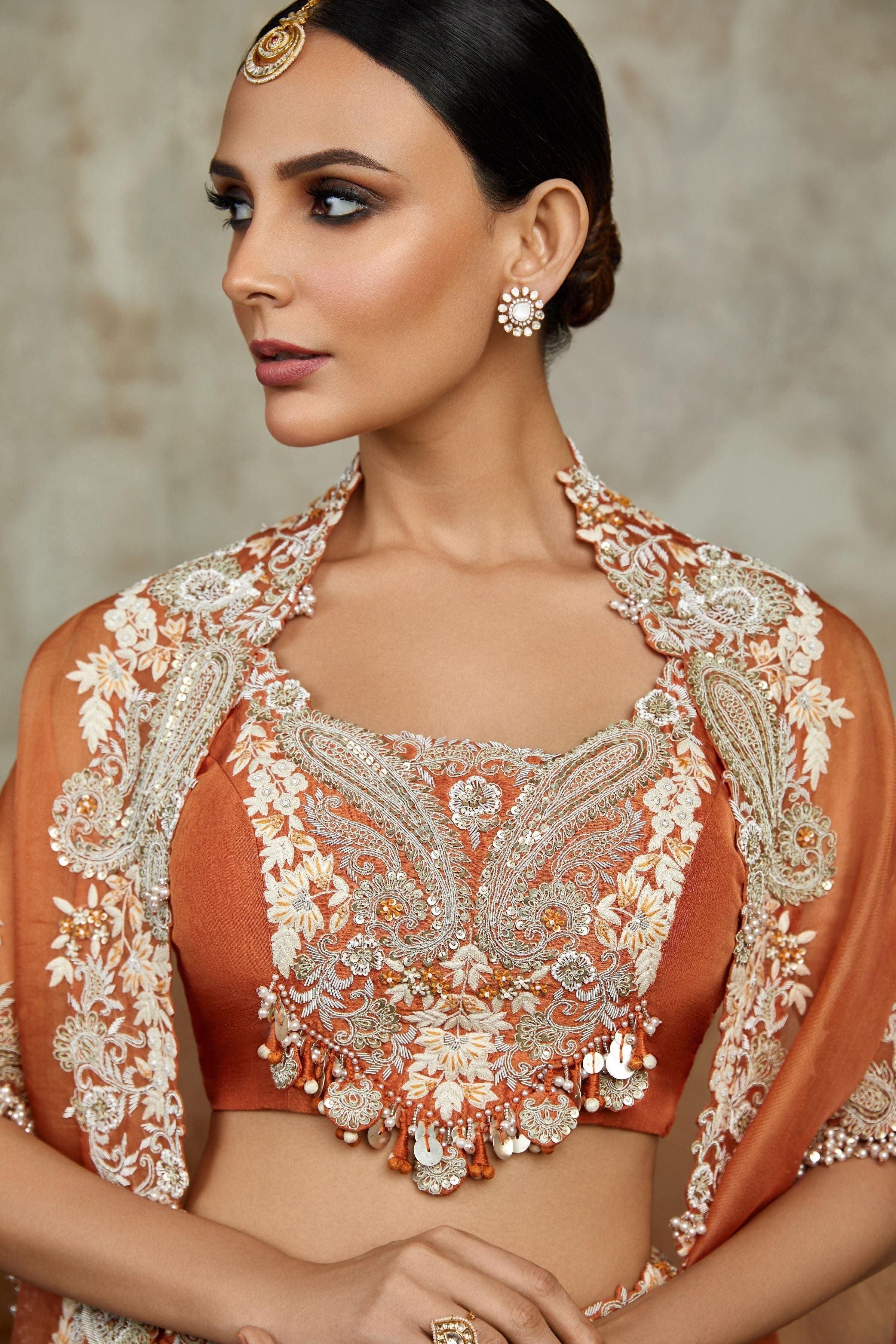 Burnt Orange Silk Blouse With Organza Cape And Skirt - Mokshaa