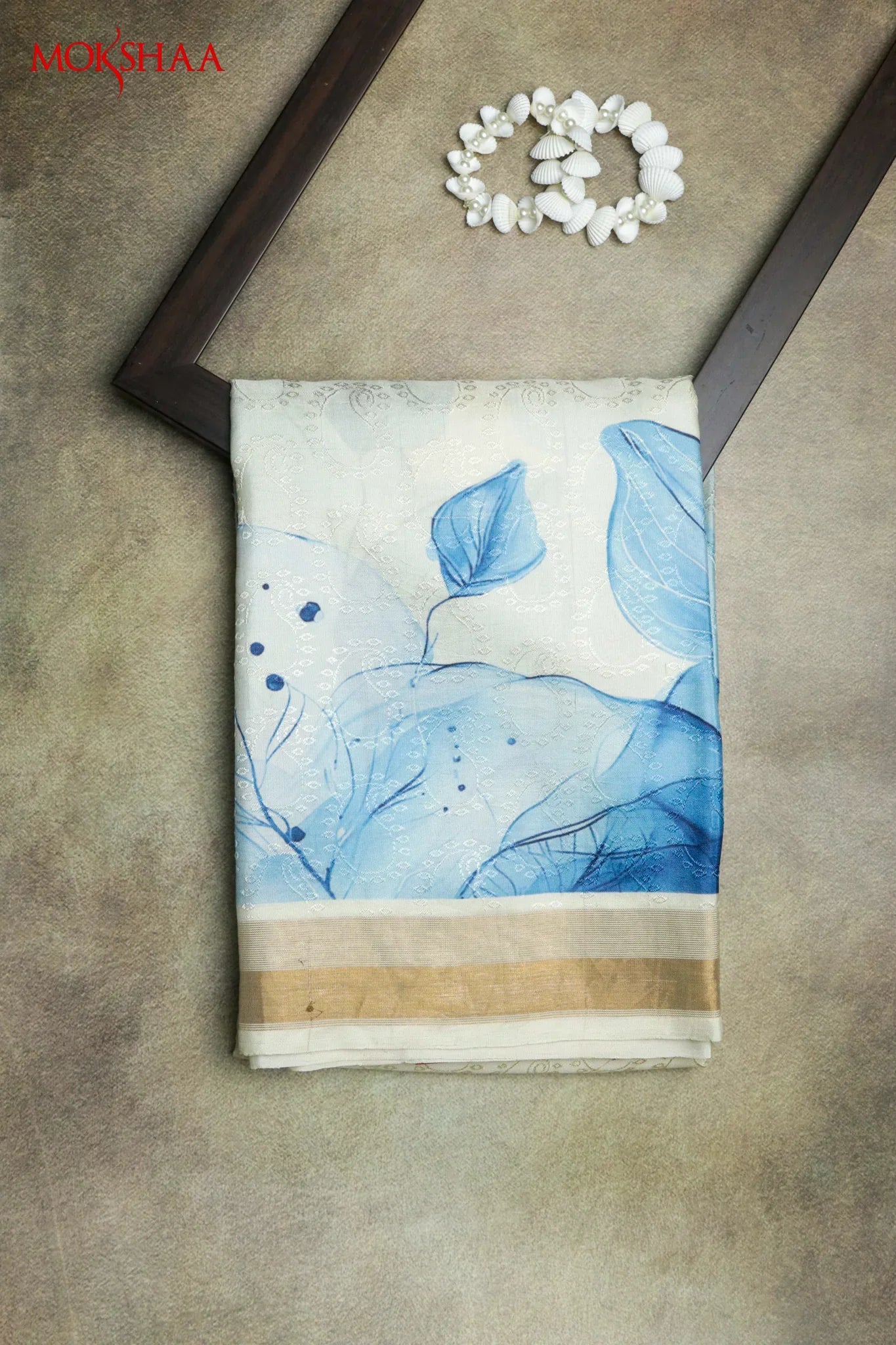 Off White Silk Saree with Blue Leaf Print Border - Mokshaa