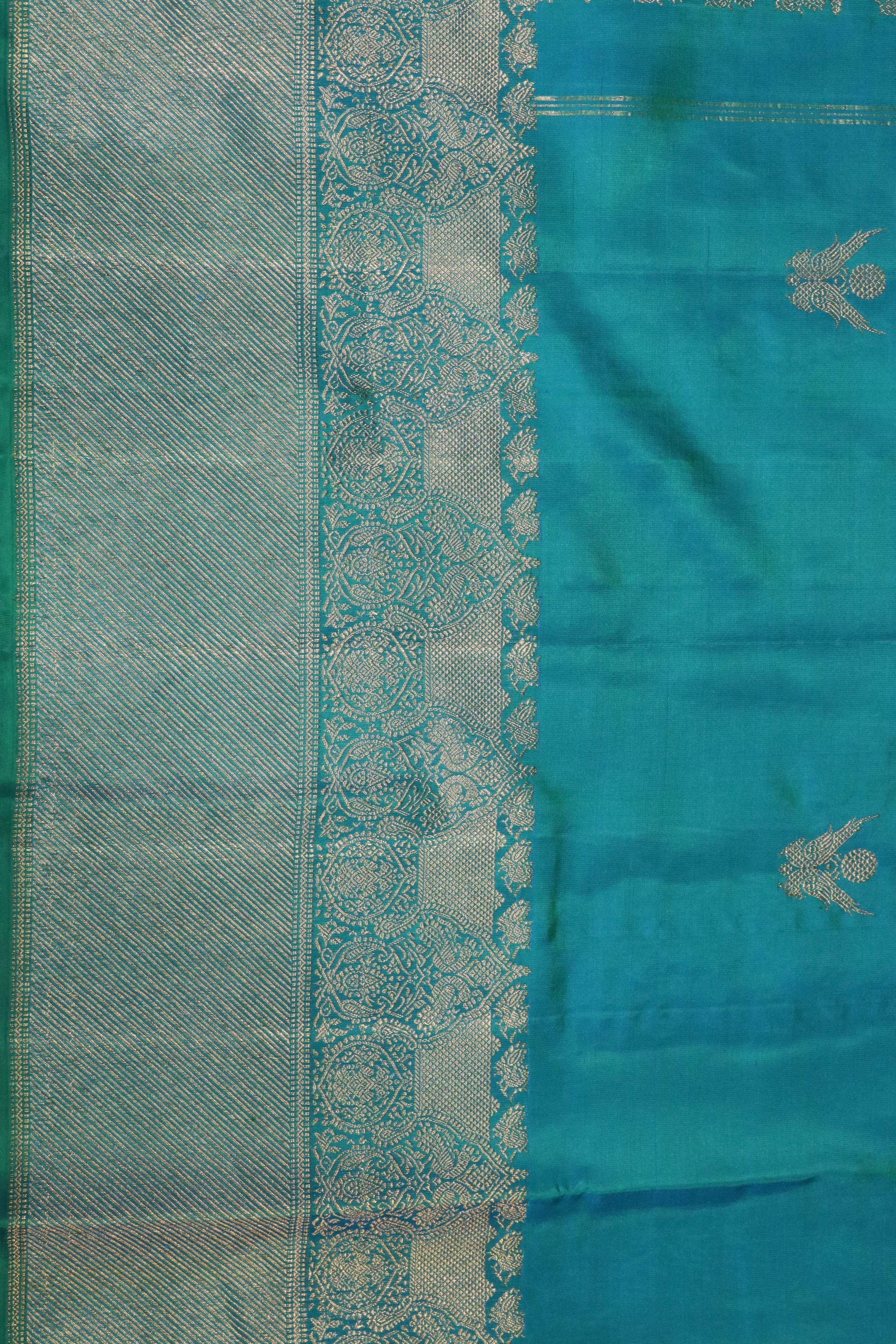 Turquoise Blue Kanchivaram Silk Saree with Fancy Zari Butta - Mokshaa